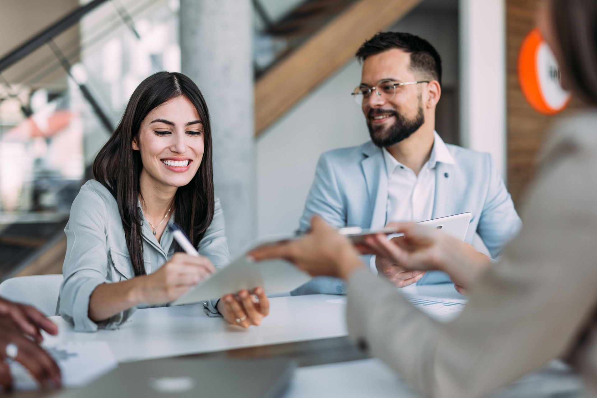 Business people signing a contract in the office.