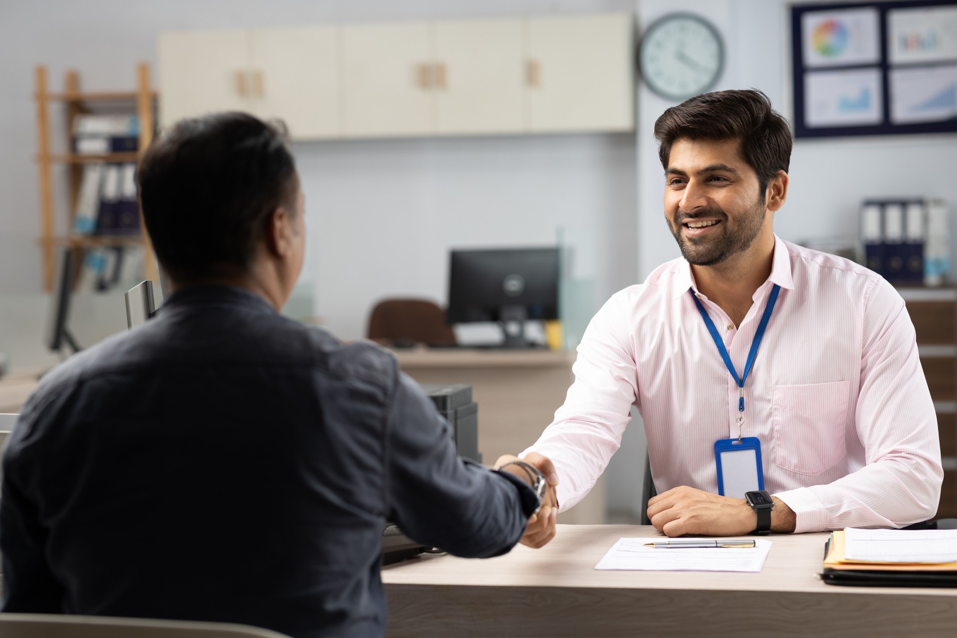 Customer with bank manager in office stock photo